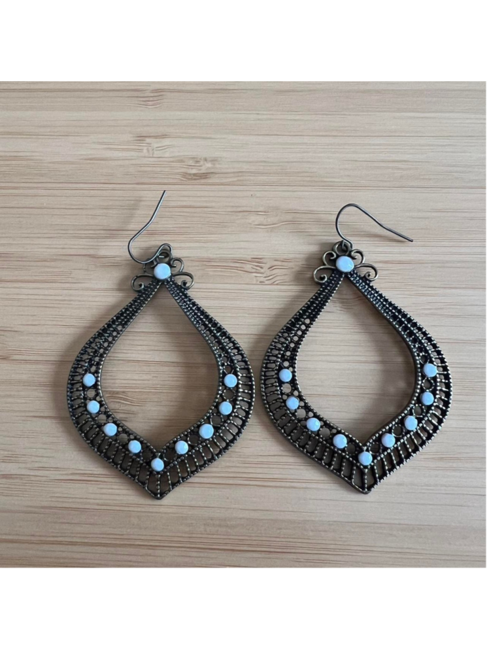 Vintage-looking gold/brass drop earrings with white stones